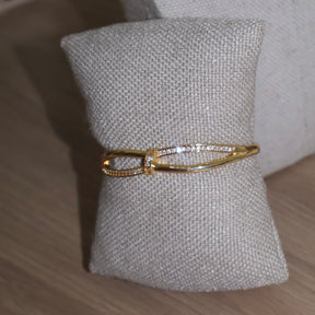 BRACELETE CRUZADO CRAVEJADO
