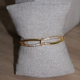 BRACELETE CRUZADO CRAVEJADO
